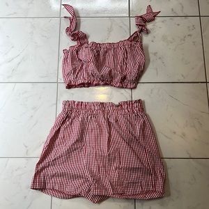 Red and white checkered shorts and crop top set.